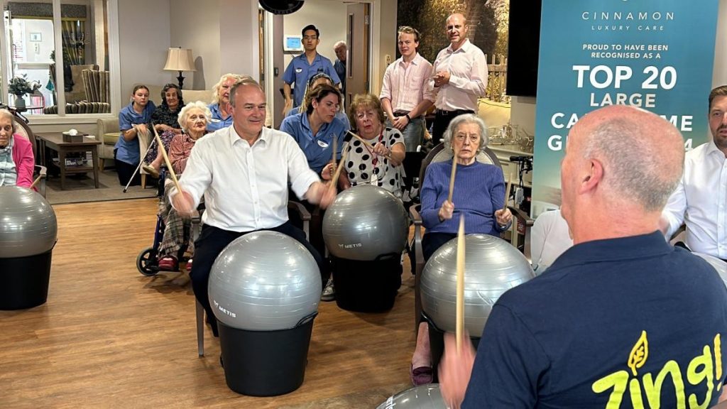 Lib Dem leader Ed Davey drums at Romsey care facility on campaign trip.