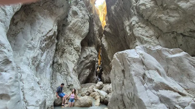 The ‘Hidden Valley’ where tourists wade through icy water to reach a secret waterfall